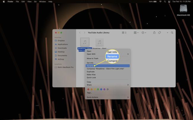 Using a contextual menu to rename a file in the Finder on a Mac.