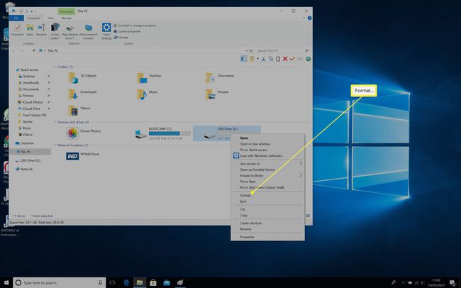 Windows 10 desktop with This PC open and a USB drive right clicked with Format highlighted on menu