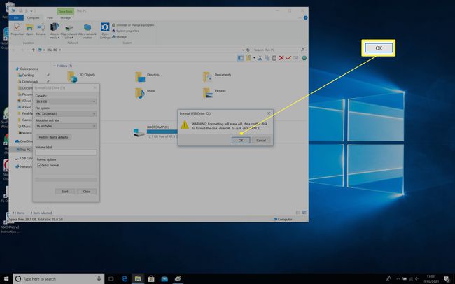 Format USB Drive dialog with the OK button highlighted for agreeing to it